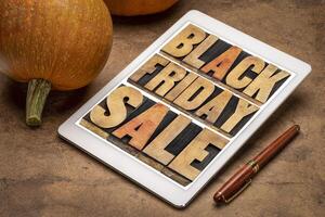 Black Friday sale word abstract on tablet photo