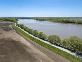 dusty rural road along the Missouri River near WIlton, MO, springtime aerial view photo