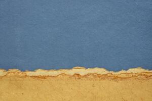 abstract landscape in pastel tones with a blue sky - a collection of handmade rag papers photo