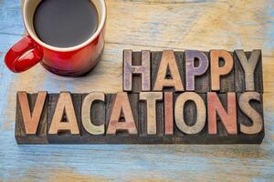 Happy vacations in wood type photo