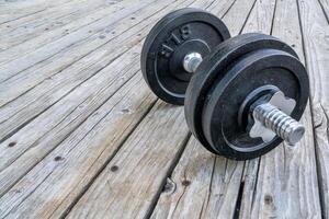 cast iron dumbbell on deck photo