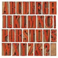 wood type alphabet stained by red photo