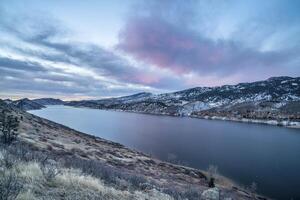 winter dawn over mountain lake photo