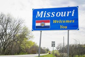 Missouri Welcomes You - a roadside sign on a rural highway near Lamoni, Idaho. photo