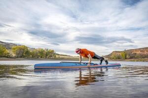 fitness on stand up paddleboard photo