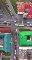 vertical accelerated aerial above road junction with heavy traffic video