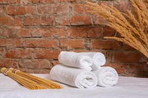 Beautiful spa composition on massage table in wellness center photo