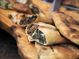 Panzerotti stuffed pasta street food at syracuse market photo