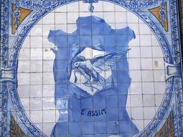 blue ceramic tiles on Old town building in Aveiro pictoresque village street view, The Venice Of Portugal photo