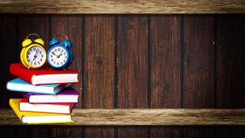 World book day. Stack of colorful books with open book on teal background. Education photo