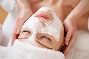 Serene young woman enjoys a luxurious facial spa treatment in a peaceful wellness retreat photo