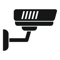 Black and white icon of a mounted security camera for surveillance purposes vector