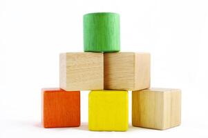 Wooden toy blocks on white background photo
