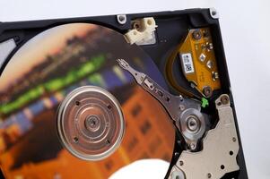 Close-up inside view of hard disk isolated on white background photo