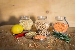 Raw cereals set on wooden background photo