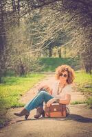 Fashion shot of a beautiful boho style girl on nature background. Boho, hippie. photo