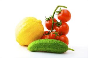 Ripe tomatoes on a branch on a white background photo