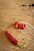 Red chilli pepper on a wooden background photo