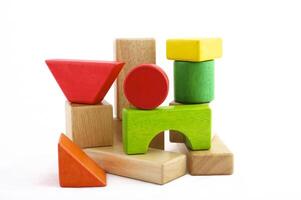 Wooden toy blocks on white background photo