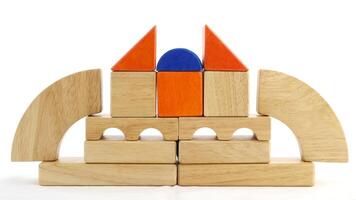 Wooden toy blocks on white background photo