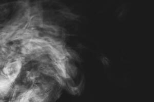 White smoke isolated on black background photo