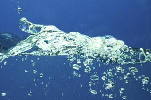 Fresh water with waves and bubbles photo