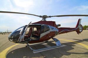 Helicopter standing on the helipad at the airport photo