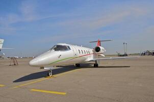 business plane parked at the airport photo