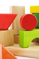 Wooden toy blocks on white background photo