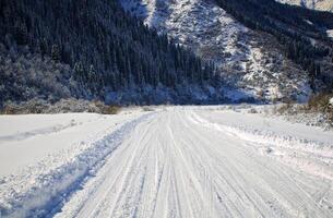 Winter road in the mountains photo