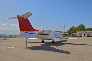 business plane parked at the airport photo