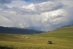 Off-road car highly in mountains photo