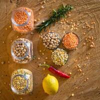 Raw cereals set on wooden background photo