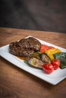 Steak on serving plate photo