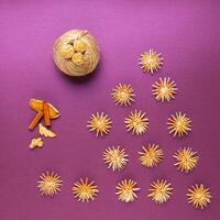 Christmas treats, Sliced dried organges fruit, cinnamon and wooden toys. photo