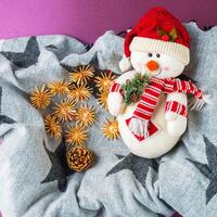 Happy snowman in a box with Christmas toys photo