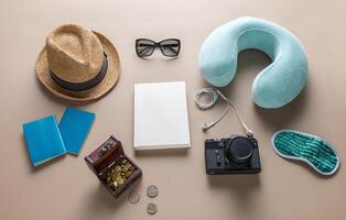 Packed suitcase of vacation items on wooden table, top view photo