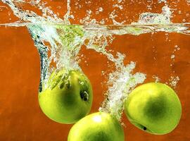 Green apples in water photo