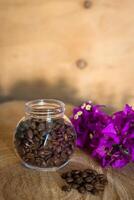 Coffee beans on a wooden table photo