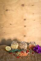 Raw cereals set on wooden background photo