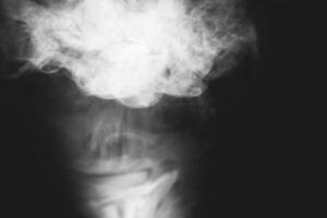 White smoke isolated on black background photo