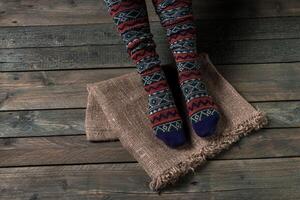 Color socks on a wooden floor photo