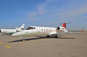 business plane parked at the airport photo