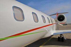 business plane parked at the airport photo