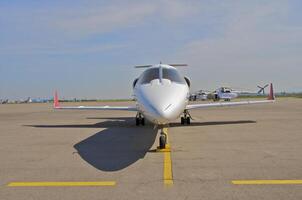 business plane parked at the airport photo