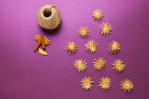 Christmas treats, Sliced dried organges fruit, cinnamon and wooden toys. photo