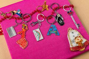 Souvenirs keychains from different cities of the world photo