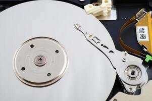 Close-up inside view of hard disk isolated on white background photo