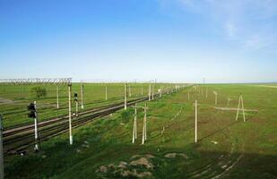 The railway in steppes of Kazakhstan photo