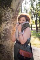 Fashion shot of a beautiful boho style girl on nature background. Boho, hippie. photo